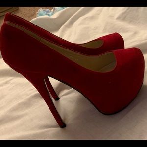 Red suede pumps